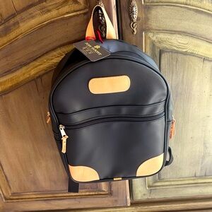 Jon Hart black and tan back pack.
